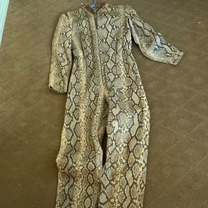 Total python Real. Jumpsuit lined  some collar discoloration